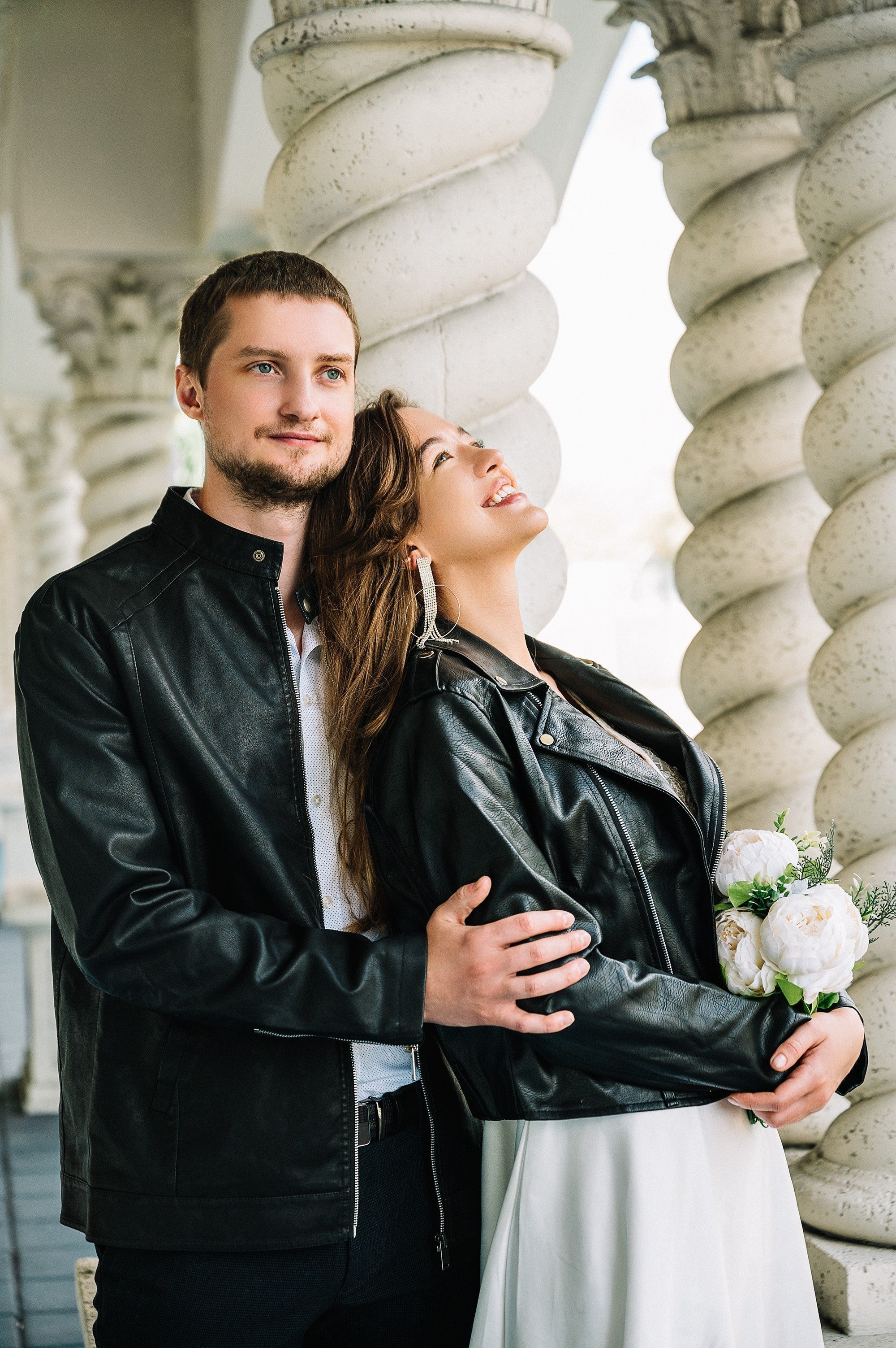 Premium Photo | Young and beautiful couple wearing leather jackets during a  date on a street